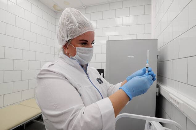 MOSCOW, RUSSIA â€” APRIL 30, 2021: A medical worker fills a syringe with the Gam-COVID-Vac vaccine (under the brand name of Sputnik V) at a temporary vaccination site in the Globus superstore. A mobile vaccination team is providing vaccines free of charge and without prior sign-up. Since the start of the pandemic, Moscow has confirmed more than 1,092,800 cases of COVID-19. Since the beginning of April, the number of new confirmed cases has been increasing in the Russian capital by more than 1,500 daily. Gavriil Grigorov TASS  TS0FEB25