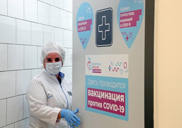 MOSCOW, RUSSIA â€” APRIL 30, 2021: A medical worker is seen at the entrance to a temporary COVID-19 vaccination site in the Globus superstore. A mobile vaccination team is providing vaccines free of charge and without prior sign-up. Since the start of the pandemic, Moscow has confirmed more than 1,092,800 cases of COVID-19. Since the beginning of April, the number of new confirmed cases has been increasing in the Russian capital by more than 1,500 daily. Gavriil Grigorov TASS  TS0FEB28