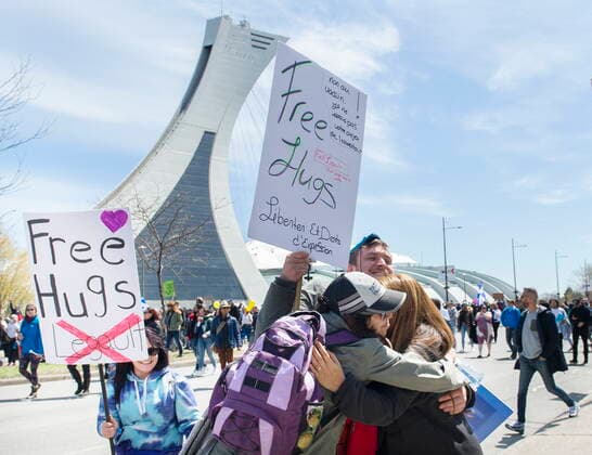 May 1, 2021, Montreal, PQ, Canada: People hug as they take part in a demonstration opposing the Quebec governmentÃ¢â‚¬â ¢s measures to help curb the spread of COVID-19 in Montreal, Saturday, May 1, 2021. Montreal Canada  - ZUMAc35_ 20210501_zaf_c35_048 Copyright: xGrahamxHughesx