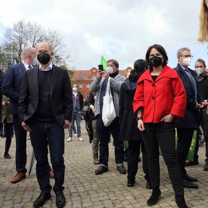 Federal Minister of Finance and candidate for chancellor Olaf Scholz SPD and candidate for chancellor Annalena Baerbock Bündnis 90 Die Grünen stand next to each other during a rally of the DGB for Labour Day at Bassinplatz in Potsdam, 1 May 2021 May Day rally in Potsdam