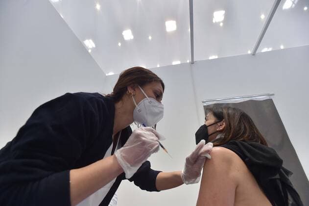 Photo IPP Felice De Martino Naples 02 05 2021 Chronicle Inauguration hub vaccine intercompany Capodichino hangar Atitech In the photo The administration of the vaccine to a patient Italy Photo Press World  0