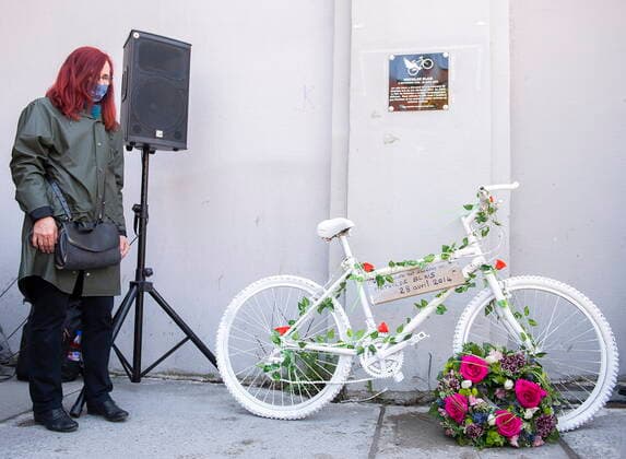 May 2, 2021, Montreal, PQ, Canada: Genevieve Laborde, mother of Mathilde Blais, stands next to a white bicycle and plaque in memory of Blais following a ceremony in Montreal on Sunday, May 2, 2021. Blais was killed at this spot in 2014 and the bike has been donated to the Museum of Civilization in Quebec City. Montreal Canada  - ZUMAc35_ 20210502_zaf_c35_006 Copyright: xGrahamxHughesx