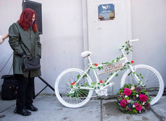 May 2, 2021, Montreal, PQ, Canada: Genevieve Laborde, mother of Mathilde Blais, stands next to a white bicycle and plaque in memory of Blais following a ceremony in Montreal, Sunday, May 2, 2021. Blais was killed at this spot in 2014 and the bike has been donated to the Museum of Civilization in Quebec City. Montreal Canada  - ZUMAc35_ 20210502_zaf_c35_007 Copyright: xGrahamxHughesx