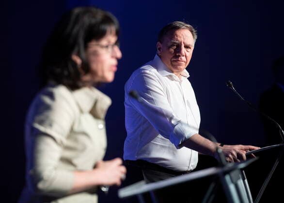 News Bilder des Tages May 2, 2021, Montreal, PQ, Canada: Quebec Premier Francois Legault looks on as Sonia Lebel, Minister Responsible for Government Administration, speaks during a news conference following a meeting with union leaders in Montreal, Sunday, May 2, 2021. Montreal Canada  - ZUMAc35_ 20210502_zaf_c35_014 Copyright: xGrahamxHughesx