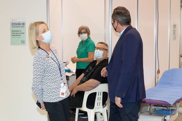 MARK MCGOWAN COVID19 VACCINATION, WA Premier Mark McGowan is seen talking with a member of the public in a mass vaccination centre at Claremont Showgrounds in Perth, Monday, May 2, 2021. From today over-50s are eligible for the Covid-19 immunisation program at two mass public vaccination clinics in Perth. ( NO ARCHIVING, EDITORIAL USE ONLY, NO USE IN BOOKS WITHOUT CONSENT PERTH WA AUSTRALIA  Copyright: xRICHARDxWAINWRIGHTx 20210503001539404012