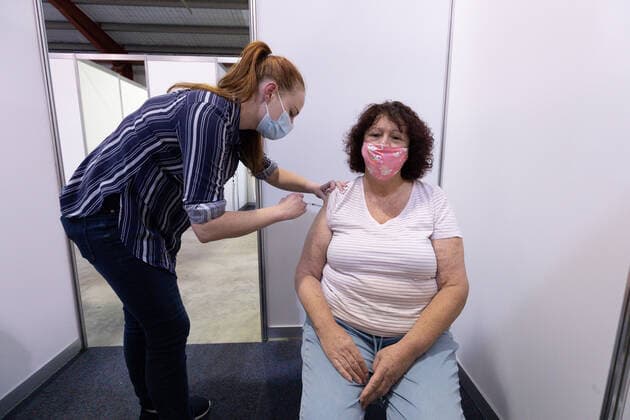 WA CORONAVIRUS COVID19, Jo Dytlewsk receives a COVID-19 AstraZeneca vaccine from nurse Siobhan Cheeseman at the Claremont Showground mass vaccination centre in Perth, Monday, May 2, 2021. From today over-50s are eligible for the Covid-19 immunisation program at two mass public vaccination clinics in Perth. ( NO ARCHIVING, EDITORIAL USE ONLY, NO USE IN BOOKS WITHOUT CONSENT PERTH WA AUSTRALIA  Copyright: xRICHARDxWAINWRIGHTx 20210503001539409700