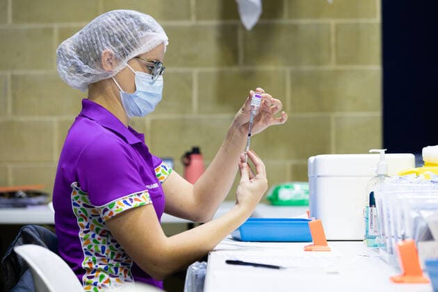 WA CORONAVIRUS COVID19, A nurse fills a syringe with the COVID-19 AstraZeneca vaccine at the Claremont Showgrounds mass vaccination centre in Perth, Monday, May 2, 2021. From today over-50s are eligible for the Covid-19 immunisation program at two mass public vaccination clinics in Perth. ( NO ARCHIVING, EDITORIAL USE ONLY, NO USE IN BOOKS WITHOUT CONSENT PERTH WA AUSTRALIA  Copyright: xRICHARDxWAINWRIGHTx 20210503001539409949
