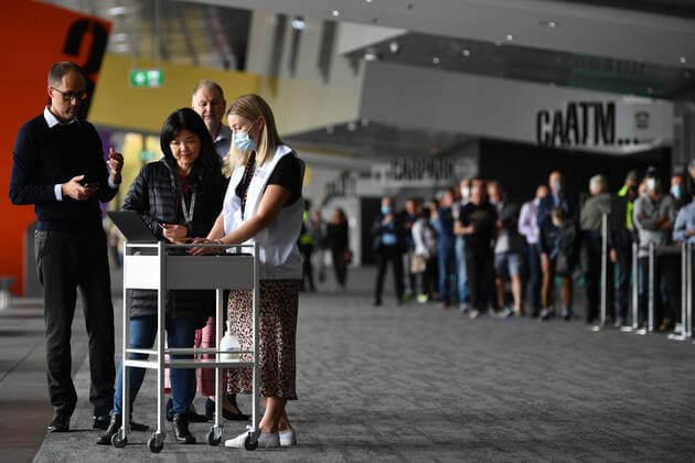 VICTORIA CORONAVIRUS COVID19, People are seen waiting in a line for a Covid19 vaccination at the Melbourne Convention and Exhibition Centre vaccination centre in Melbourne, Monday, May 3, 2021. All Australians over the age of 50 are eligible to receive a vaccination. ( NO ARCHIVING, EDITORIAL USE ONLY, NO USE IN BOOKS WITHOUT CONSENT MELBOURNE VIC AUSTRALIA  Copyright: xJAMESxROSSx 20210503001539411951
