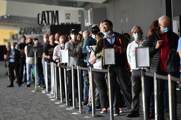 VICTORIA CORONAVIRUS COVID19, People are seen waiting in a line for a Covid19 vaccination at the Melbourne Convention and Exhibition Centre vaccination centre in Melbourne, Monday, May 3, 2021. All Australians over the age of 50 are eligible to receive a vaccination. ( NO ARCHIVING, EDITORIAL USE ONLY, NO USE IN BOOKS WITHOUT CONSENT MELBOURNE VIC AUSTRALIA  Copyright: xJAMESxROSSx 20210503001539412013