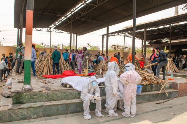 May 3, 2021, New Delhi, India: EDITORS NOTE (Image depicts death).Family Members mourn their loved ones who died of COVID19 while wearing Personal Protective Equipment suits (PPE) during a mass cremation at Ghaziapur Municipal crematorium..Mass cremations in New Delhi, capital of India faces deluge of COVID-19 deaths, in the last 24 hours India has officially recorded 3417 covid-19 deaths. New Delhi India - ZUMAs197 20210503_zaa_s197_111 Copyright: xPradeepxGaurx
