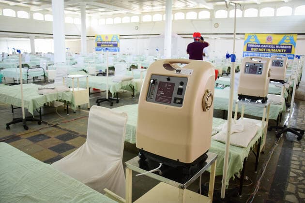 May 3, 2021, New Delhi, India: A volunteer prepares beds inside the Covid care facility for patients suffering from the coronavirus disease (COVID-19), amidst the rising number of the coronavirus cases at Rakab Ganj Gurudwara in New Delhi..Rakab ganj gurudwara s hall converted into the Covid19 care center with 250 beds facility. India has recorded more than 26 lakh new cases and nearly 23,800 deaths in the past seven days, although daily infection numbers registered a slight drop after hitting a peak of over 4 lakh on Friday. New Delhi India - ZUMAs197 20210503_zaa_s197_130 Copyright: xManishxRajputx