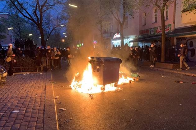 BERLIN, GERMANY â€“ MAY 1, 2021: A garbage bin is on fire during a 1 May demonstration in Neukoln-Kreuzberg. Some 5 to 8 thousand people gathered to take part in a demonstration organised by the leftist movement Revolutionaerer 1 Mai Berlin, in the afternoon on 1 May. The police stopped the demonstration since its participants were violating COVID-19 guidelines (were not wearing face masks and didnâ€™t observe social distancing). Anton Dolgunov TASS  TS0FED04