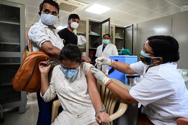 May 5, 2021, Prayagraj, Uttar Pradesh, India: Prayagraj: A medical worker inoculates a girl with a dose of Covaxin vaccine against the Covid-19 coronavirus at Moti Lal Nehru Medical College in Prayagraj on Wednesday, May 05, 2021. Prayagraj India - ZUMAv115 20210505_zap_v115_024 Copyright: xPrabhatxKumarxVermax