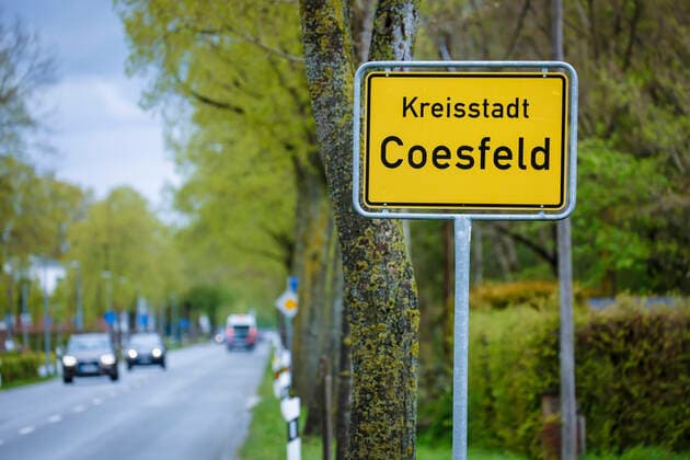 Coesfeld, North Rhine-Westphalia, Germany Place name sign in times of Corona pandemic, Coesfeld district starts as model region in NRW with relaxations Coesfeld North Rhine-Westphalia Germany