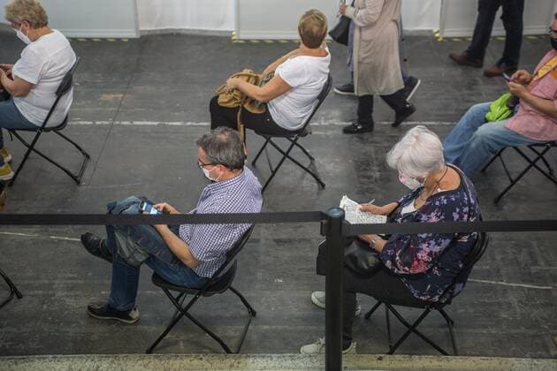 May 5, 2021, Barcelona, Catalonia, Spain: People are seen awaiting vaccination..To accelerate the vaccination of COVID-19 and decongest primary care centers, the Barcelona s trade fair institution, Fira Barcelona, has become, since April 30, a mass vaccination center. It is the first in all of Catalonia, with the capacity to administer up to 120,000 vaccines a week. This space is added to the fifty municipal spaces enabled by the Barcelona City Council as COVID-19 vaccination spaces. Barcelona Spain - ZUMAd159 20210505_zia_d159_013 Copyright: xThiagoxPrudenciox