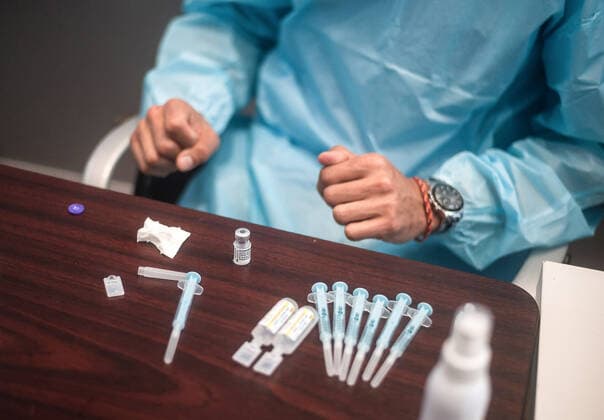 May 5, 2021, Malaga, Spain: A health worker seen preparing a dose of Pfizer vaccine during a massive vaccination at Fair and Congresses Palace..Health regional authorities have retimed again the vaccination with doses of Pfizer BioNTech inside large and secure places following all protective measures, as part of massive vaccination One million plan after the announcement of Andalusian government to inoculate around 600.000 vaccines during the week. Malaga Spain - ZUMAs197 20210505_zaa_s197_015 Copyright: xJesusxMeridax