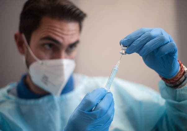 May 5, 2021, Malaga, Spain: A health worker seen preparing a dose of Pfizer vaccine in a syringe during a massive vaccination at Fair and Congresses Palace..Health regional authorities have retimed again the vaccination with doses of Pfizer BioNTech inside large and secure places following all protective measures, as part of massive vaccination One million plan after the announcement of Andalusian government to inoculate around 600.000 vaccines during the week. Malaga Spain - ZUMAs197 20210505_zaa_s197_018 Copyright: xJesusxMeridax