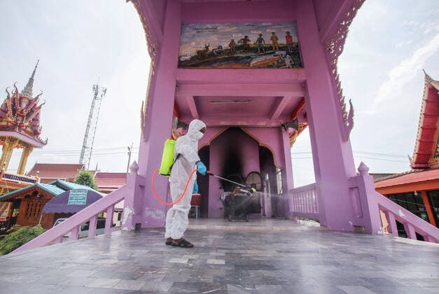 May 5, 2021, Nonthaburi, Thailand: A Buddhist monk wearing personal protective equipment suites (PPE) sprays disinfectant at the crematorium before a cremation rite of a free cremation funeral for a COVID-19 victim with monks in attendance of the ceremony at Wat Bang Muang, in Nonthaburi province. .The government on Wednesday reported 15 new Covid-19 deaths, bringing the toll to 318, and 2,112 new cases, raising the total to 74,900. Nonthaburi Thailand - ZUMAs197 20210505_zaa_s197_072 Copyright: xChaiwatxSubprasomx