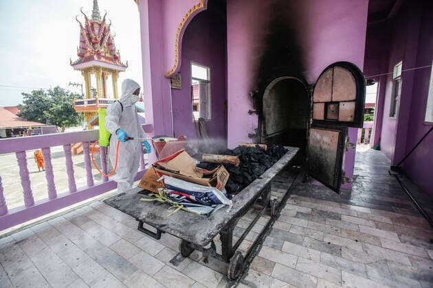 May 5, 2021, Nonthaburi, Thailand: A Buddhist monk wearing personal protective equipment suites (PPE) sprays disinfectant at the crematorium before a cremation rite of a free cremation funeral for a COVID-19 victim with monks in attendance of the ceremony at Wat Bang Muang, in Nonthaburi province. .The government on Wednesday reported 15 new Covid-19 deaths, bringing the toll to 318, and 2,112 new cases, raising the total to 74,900. Nonthaburi Thailand - ZUMAs197 20210505_zaa_s197_075 Copyright: xChaiwatxSubprasomx