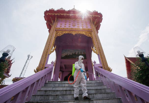 May 5, 2021, Nonthaburi, Thailand: A Buddhist monk wearing personal protective equipment suites (PPE) sprays disinfectant at the crematorium before a cremation rite of a free cremation funeral for a COVID-19 victim with monks in attendance of the ceremony at Wat Bang Muang, in Nonthaburi province. .The government on Wednesday reported 15 new Covid-19 deaths, bringing the toll to 318, and 2,112 new cases, raising the total to 74,900. Nonthaburi Thailand - ZUMAs197 20210505_zaa_s197_076 Copyright: xChaiwatxSubprasomx