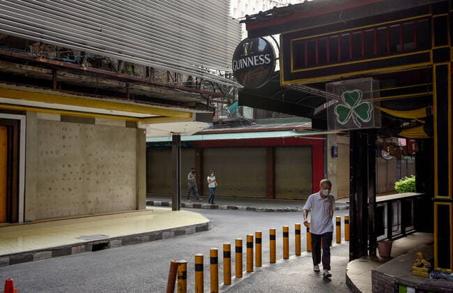 May 5, 2021, Bangkok, Thailand: View of an empty intersection of closed Go go bars at the internationally famous red light district , Patpong..Bangkok night life entertainment venues, bars, pubs and restaurants are closed in the designated red zone. A partial lockdown has been imposed for 2 weeks during May 3 -17, 2021, due to a recent upsurge of the Covid C-19 virus outbreak in the capital. Bangkok Thailand - ZUMAs197 20210505_zaa_s197_178 Copyright: xPaulxLakatosx