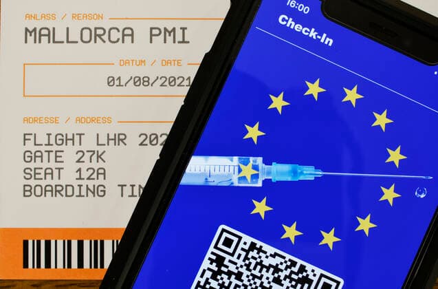 Symbol photo vaccination privileges, smartphone with digital European vaccination card with QR code, boarding pass for air travel, Corona crisis, Germany Coronavirus