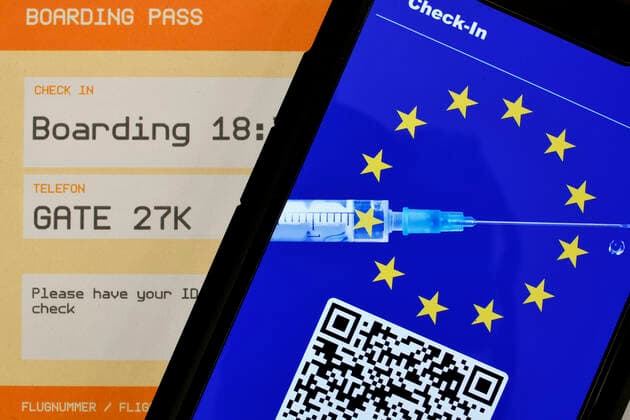 Symbol photo vaccination privileges, smartphone with digital European vaccination card with QR code, boarding pass for air travel, Corona crisis, Germany Coronavirus