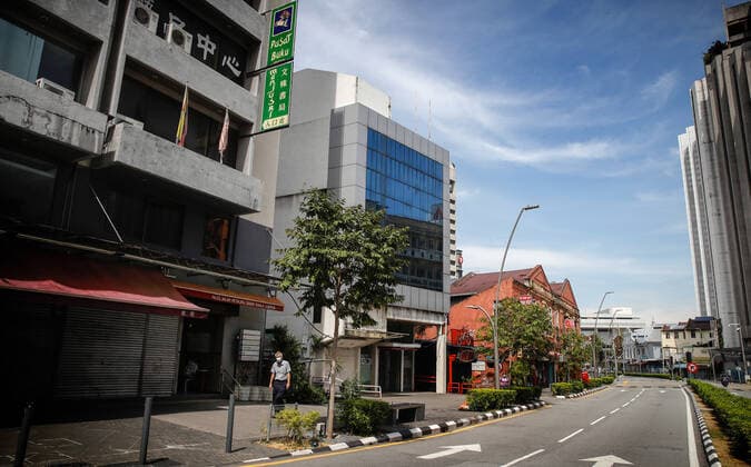 May 7, 2021, Kuala Lumpur, Malaysia: A man wearing a face mask walks on a deserted road near the China Town in Kuala Lumpur..The federal territory of Kuala Lumpur, the capital city of Malaysia is placed under the movement control order (MCO) from May 7 to May 20, 2021 due to the rise in daily cases of Covid-19 infection. Kuala Lumpur Malaysia - ZUMAs197 20210507_zaa_s197_021 Copyright: xWongxFokxLoyx
