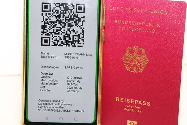 Symbolic passport and a digital green passport as proof of vaccination Copyright: xx