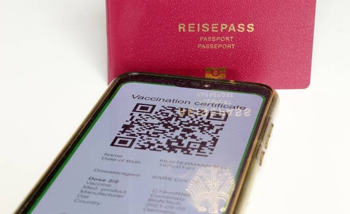 Symbolic passport and a digital green passport as proof of vaccination Copyright: xx