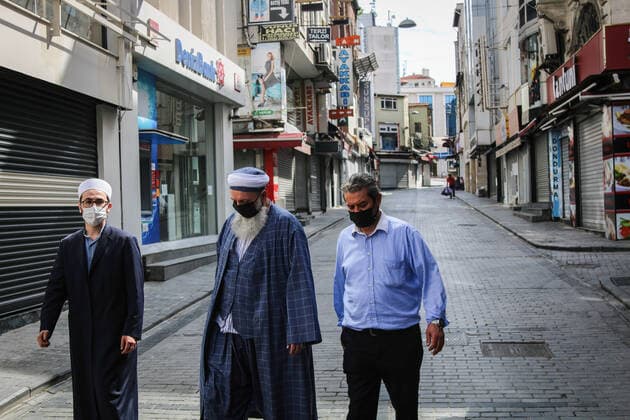 May 7, 2021, Istanbul, Turkey: People wearing face masks walk past closed shops in Eminonu during the lockdown..The Turkish government has approved full closure, which will last until May 17, to reduce rising coronavirus cases. Istanbul Turkey - ZUMAs197 20210507_zaa_s197_084 Copyright: xHakanxAkgunx