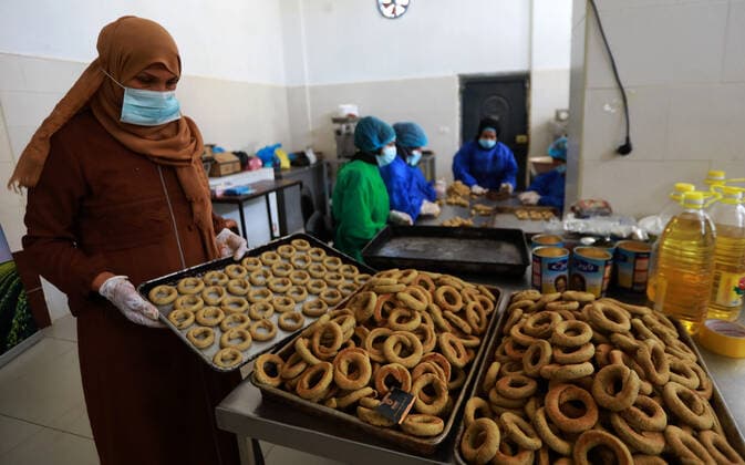Eid Al-Fitr Holiday In Gaza City Palestinian women prepare traditional date-filled cookies in preparation for the Eid al-Fitr holiday in the northern Gaza Strip, on May 8, 2021. Muslims around the world are preparing to celebrate the Eid al-Fitr holiday, which marks the end of the fasting month of Ramadan. Gaza Palestine fathi-notitle210508_npod3  Copyright: xMajdixFathix