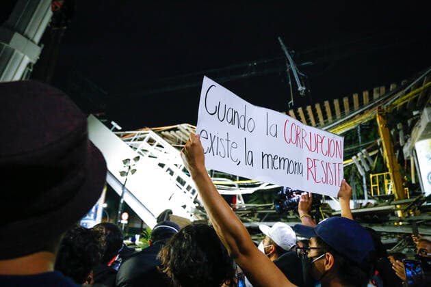 May 7, 2021, Mexico City, Mexico: A protester carries a sign that reads when corruption exists, memory resists during a protest march in Tlahuac Mayoralty..Protesters take to the streets of Mexico city demanding justice for those involved in the subway overpass incident that collapsed and has killed 25 people so far. Mexico City Mexico - ZUMAs197 20210507_zaa_s197_174 Copyright: xGuillermoxDiazx
