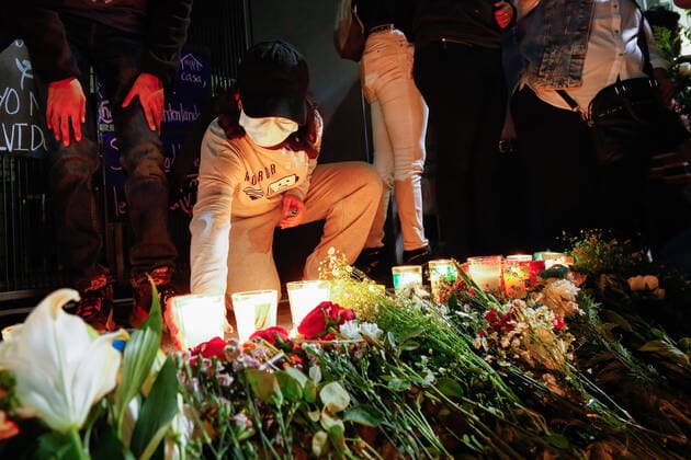 May 7, 2021, Mexico City, Mexico: A young woman leaves a candle on a shrine for those killed, during a protest march in Tlahuac Mayoralty..Protesters take to the streets of Mexico city demanding justice for those involved in the subway overpass incident that collapsed and has killed 25 people so far. Mexico City Mexico - ZUMAs197 20210507_zaa_s197_176 Copyright: xGuillermoxDiazx