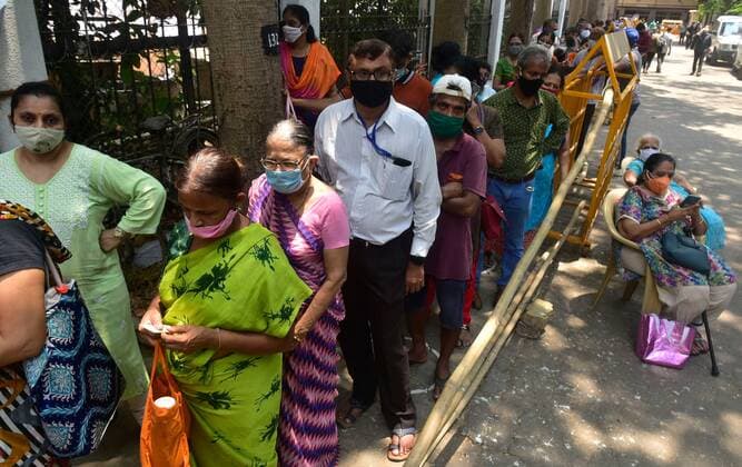 MUMBAI, INDIA - MAY 7: People lined up to get vaccinated against COVID-19 at Nair Hospital, on May 7, 2021 in Mumbai, India. (Photo by Anshuman Poyrekar Hindustan Times) COVID-19 Vaccination Drive