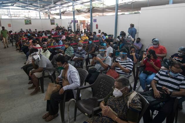 MUMBAI, INDIA - MAY 7: Beneficiaries sit inside an observation hall after receiving a dose of Covishield vaccine at Rajawadi Hospital, Ghatkopar, on May 7, 2021 in Mumbai, India. (Photo by Pratik Chorge Hindustan Times) COVID-19 Vaccination Drive