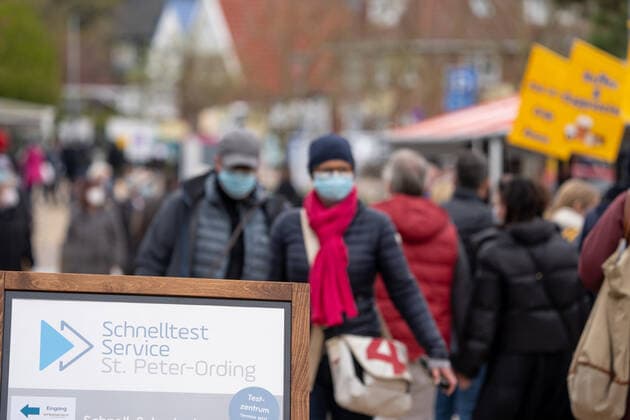 Sign to the quick test service in the pedestrian precinct model region St Peter Ording in Schleswig Holstein at the North Sea Sign to the quick test service in the pedestrian precinct model region St Peter Ording in Schleswig Holstein at the North Sea , Sankt Peter Ording Schleswig Holstein Germany Ording