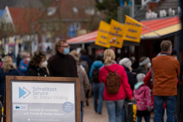 Sign to the quick test service in the pedestrian precinct model region St Peter Ording in Schleswig Holstein at the North Sea Sign to the quick test service in the pedestrian precinct model region St Peter Ording in Schleswig Holstein at the North Sea , Sankt Peter Ording Schleswig Holstein Germany Ording