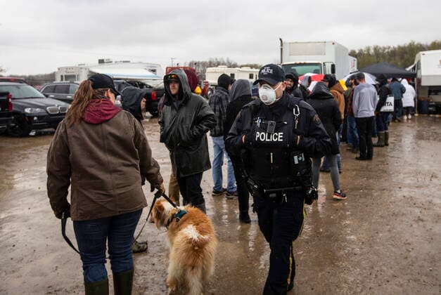May 8, 2021, Mirror, ab, Canada: Police walk through the crowds during a rally against measures taken by government and health authorities to curb the spread of COVID-19 at the Whistle Stop cafe in Mirror Alta, on Saturday May 8, 2021. The Whistle Stop was shut down by AHS for not complying with COVID-19 rules. Mirror Canada  - ZUMAc35_ 20210508_zaf_c35_077 Copyright: xJasonxFransonx