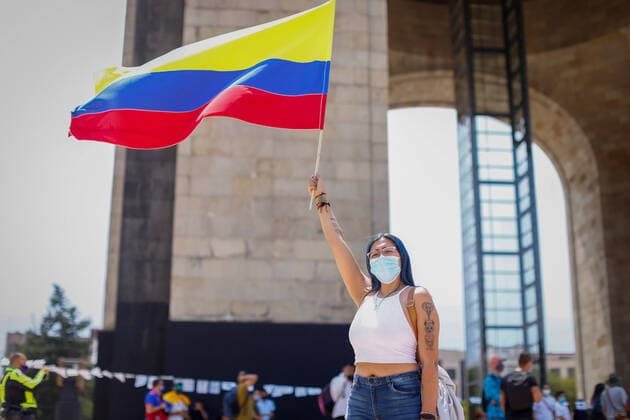 May 8, 2021, Mexico City, Mexico: A Colombian citizen rising up a flag during a protest in support of the National Strike in Colombia..Several demonstrations have been carried out in Mexico City rejecting the militarization exercised by the President of Colombia Ivan Duque Marquez. Mexico City Mexico - ZUMAs197 20210508_zaa_s197_229 Copyright: xGuillermoxDiazx