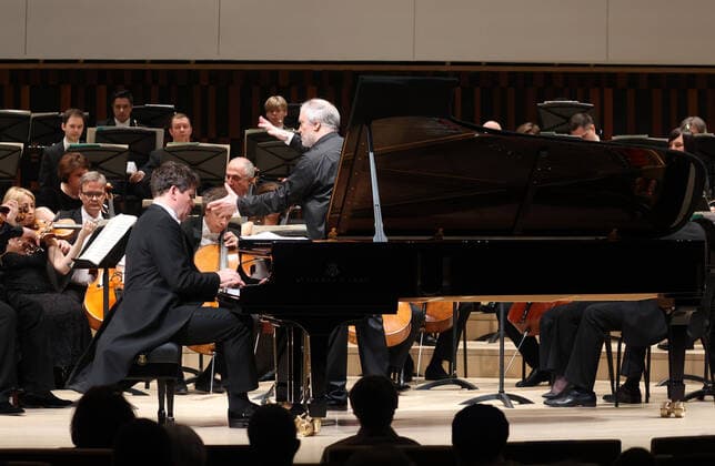 MOSCOW, RUSSIA â€” MAY 9, 2021: Pianist Denis Matsuev (front seated) and the artistic director of the Mariinsky Theatre, conductor Valery Gergiev (C standing), perform with the Mariinsky Theatre Symphony Orchestra at Zaryadye Concert Hall at the 20th Moscow Easter Festival. Vladimir Gerdo TASS  TS0FFA38