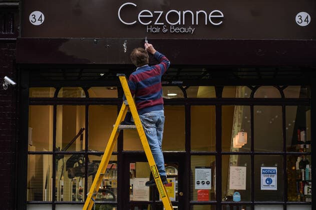Daily Life In Dublin During COVID-19 Lockdown A man paints the facade of a local Hair and Beauty Salon in Dublin city center before it reopens, scheduled for tomorrow 10 May. On Sunday, 9 May 2021, in Dublin, Ireland. Dublin Ireland widak-dublinda210509_npOov  Copyright: xArturxWidakx