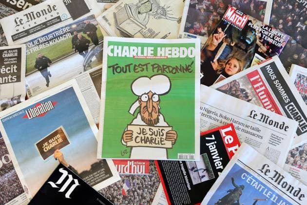 France, on 2015 01 14: front page of daily or weekly newspapers, from which the Charlie Hebdo satirical magazine France, on 2015 01 14: front page of daily or weekly newspapers, from which the Charlie Hebdo satirical magazine with its first publication after the shooting attack which resulted in the death of 12 people at the Charlie Hebdo offices on January 7, 2015. Its front cover depicts prophet Muhammad holding up a sign reading All is forgiven , on a green background. The satirical newspaper is in the middle of numerous other magazines and newspapers (from which Liberation, Le Monde, La Croix, Le Point, L Humanite, JDD, Aujourd hui en France, etc...) Eurasia; Europe; Western Europe; France  Copyright: xBigot Andia.frx 263310
