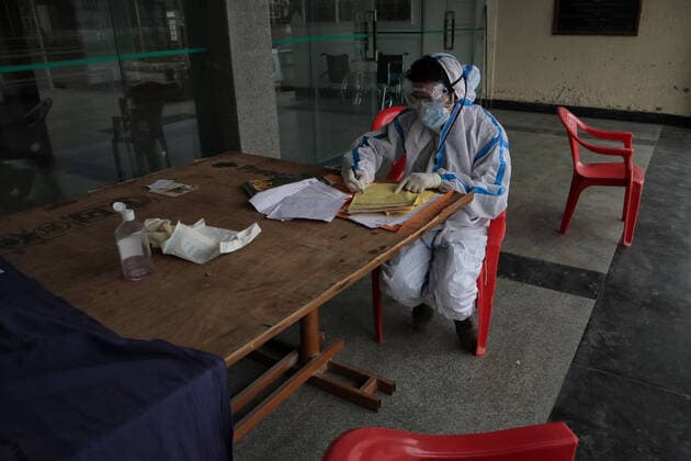 May 8, 2021: A Health worker prepare prescription at a temporary Covid-19 hospital in Srinagar, Indian Administered Kashmir on 08 May 2021. A Local NGO Athrout has converted Hajj house into a 100-bedded Covid centre as the space in hospitals is filling up fast - ZUMAd99_ 20210508_zap_d99_049 Copyright: xMuzamilxMattoox