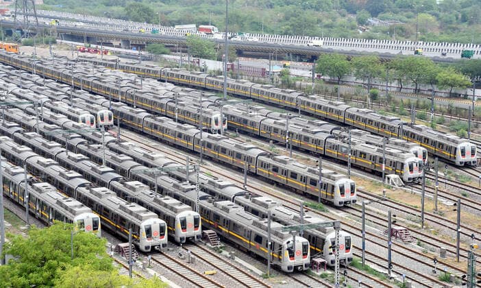 NEW DELHI, INDIA - MAY 10: Metro trains parked at a Timarpur Depot after the Delhi CM Arvind Kejriwal announce Delhi Metro closed due to Covid 19 restrictions during the lockdown, Delhi Metro rail services to remain temporarily suspended till 5 am on 17th May, as the national capital enters into an extended period of lockdown with strict restrictions on May 10, 2021 in New Delhi, India. In an effort to check the rising Covid-19 cases, Delhi government has extended the lockdown in the national capital for another week till May 17. Delhi Metro services have also been suspended from Monday, the chief minister informed. Delhi has been under a lockdown since April 20 in view of the second Covid-19 wave. (Photo by Sonu Mehta Hindustan Times) Del