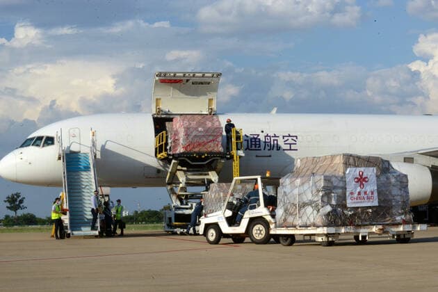 (210511) -- VIENTIANE, May 11, 2021 -- Workers unload anti-epidemic material supplies donated by the Chinese government from a Chinese cargo plane at Wattay International Airport in Vientiane, Laos, May 10, 2021. The Chinese government-donated anti-COVID-19 material supplies have arrived at Wattay International Airport in Lao capital Vientiane with a handover ceremony held upon their arrival. The Chinese government s emergency assistance to Laos includes ventilators, automatic nucleic acid extractors, medical masks, N95 masks, mobile hospital beds, automatic autoclaves, nucleic acid extraction or purification reagents, and nucleic acid detection kits, etc. ) LAOS-VIENTIANE-CHINA-ANTI-EPIDEMIC SUPPLIES-DONATION-ARRIVAL ZhangxJianhua 