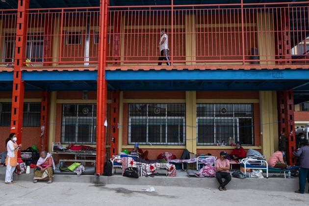 May 19, 2021, Kathmandu, Nepal: Covid-19 patients on oxygen support seen outside the hospital passage due the limited beds inside the Hospital..Nepal s Covid-19 death toll crossed the 4000-mark as staggering 225 deaths were reported on Tuesday. The total nationwide infection count has hit 413,111 with the addition of 9,317 fresh cases. Kathmandu Nepal - ZUMAs197 20210519_zaa_s197_003 Copyright: xPrabinxRanabhatx