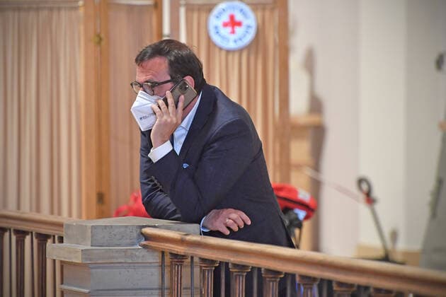 Klaus HOLETSCHEK CSU,Bavarias health minister talks on a smartphone in front of a Red Cross sign Working meeting of the CSU parliamentary group in the Bavarian state parliament on 12 05 2021