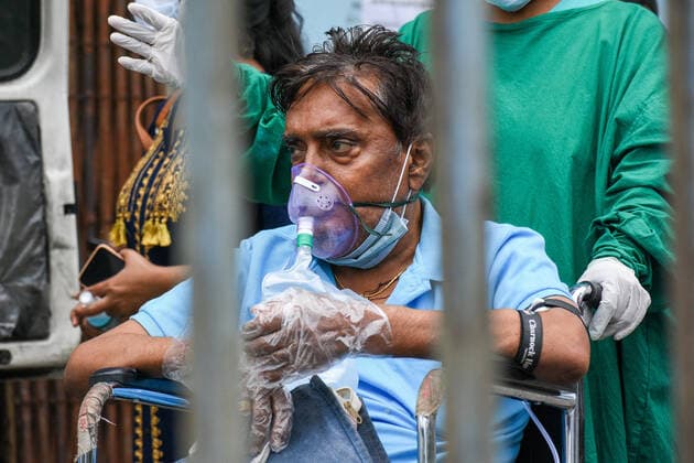 Second Wave Of COVID-19 Outbreak In India A patient who tested for COVID-19 is been taken for CT scan at a COVID-19 hospital in Kolkata , India , on 12 May 2021 . India reports over 4200 deaths and nearly 3.5 lakh cases yesterday . This backdrop came as many states which showed record number of case spike , has seen a decline of cases in last few days , to which many assumes that India has reached its peak infection according to Indian media report . Kolkata West Bengal India chatterjee-secondwa210512_np9CP  Copyright: xDebarchanxChatterjeex