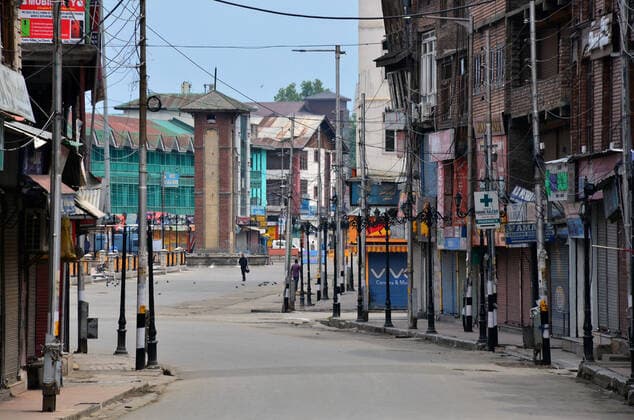 May 12, 2021, Srinagar, Jammu & Kashmir, India: A man walks through a deserted road during a strict curfew imposed following the surge in COVID-19 cases in Srinagar. .A day after several areas in Kashmir valley witnessed a huge rush of people ahead of Eid festival, strict curfew has been imposed in the valley as authorities enforced the lockdown to contain an alarming surge in coronavirus cases. Meanwhile, India recorded 348,421 new COVID-19 cases and 4,200 deaths in the last 24 hours. Srinagar India - ZUMAs197 20210512_zaa_s197_051 Copyright: xSaqibxMajeedx